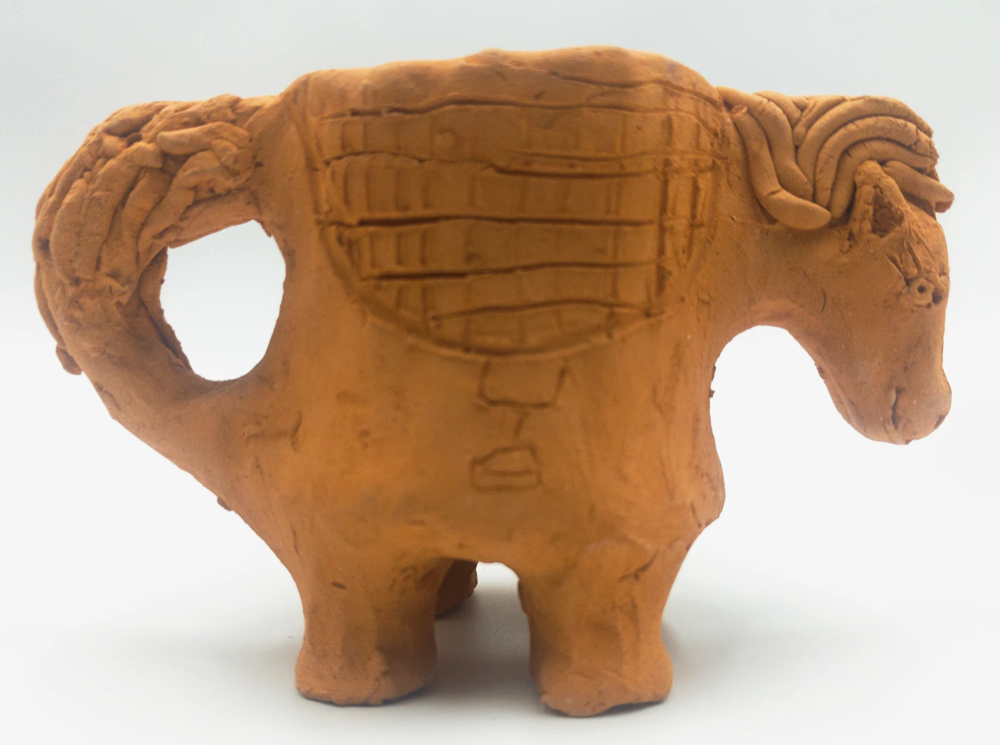 Slava Romanenko’s ceramic work “Horse-Shaped Cup” with a saddle and a handle formed as a tail.