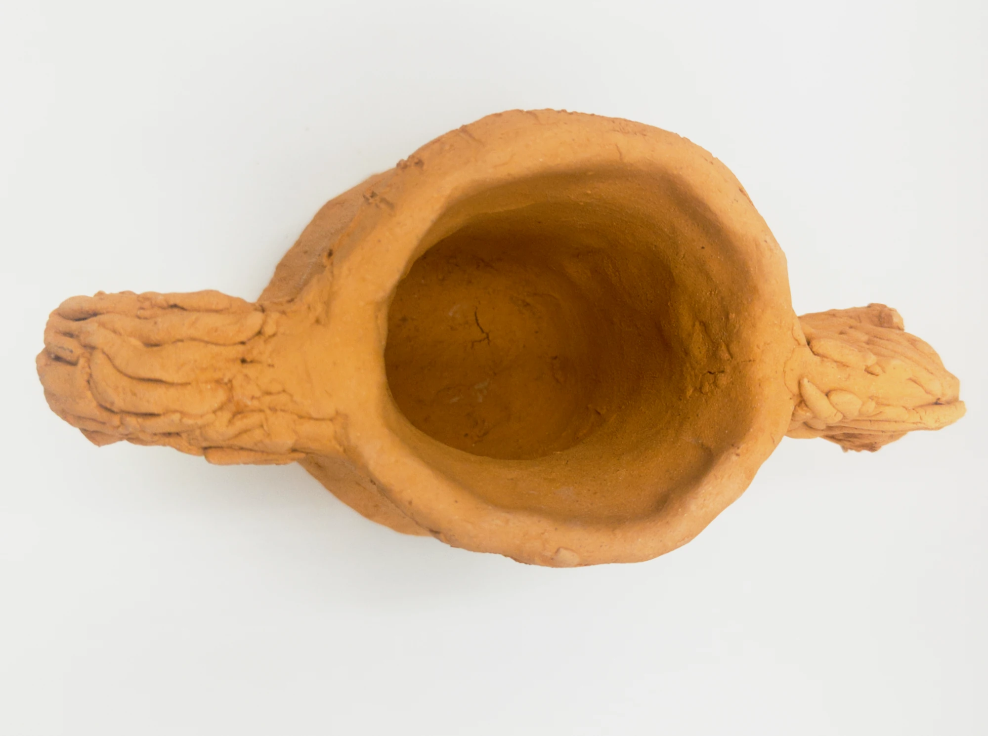 Ceramic work “Horse-Shaped Cup” viewed from above, showing the cup opening, head, saddle and tail-handle.