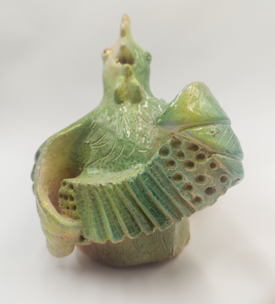 Accordion-Playing Rooster, a glazed ceramic work by Slava Romanenko.