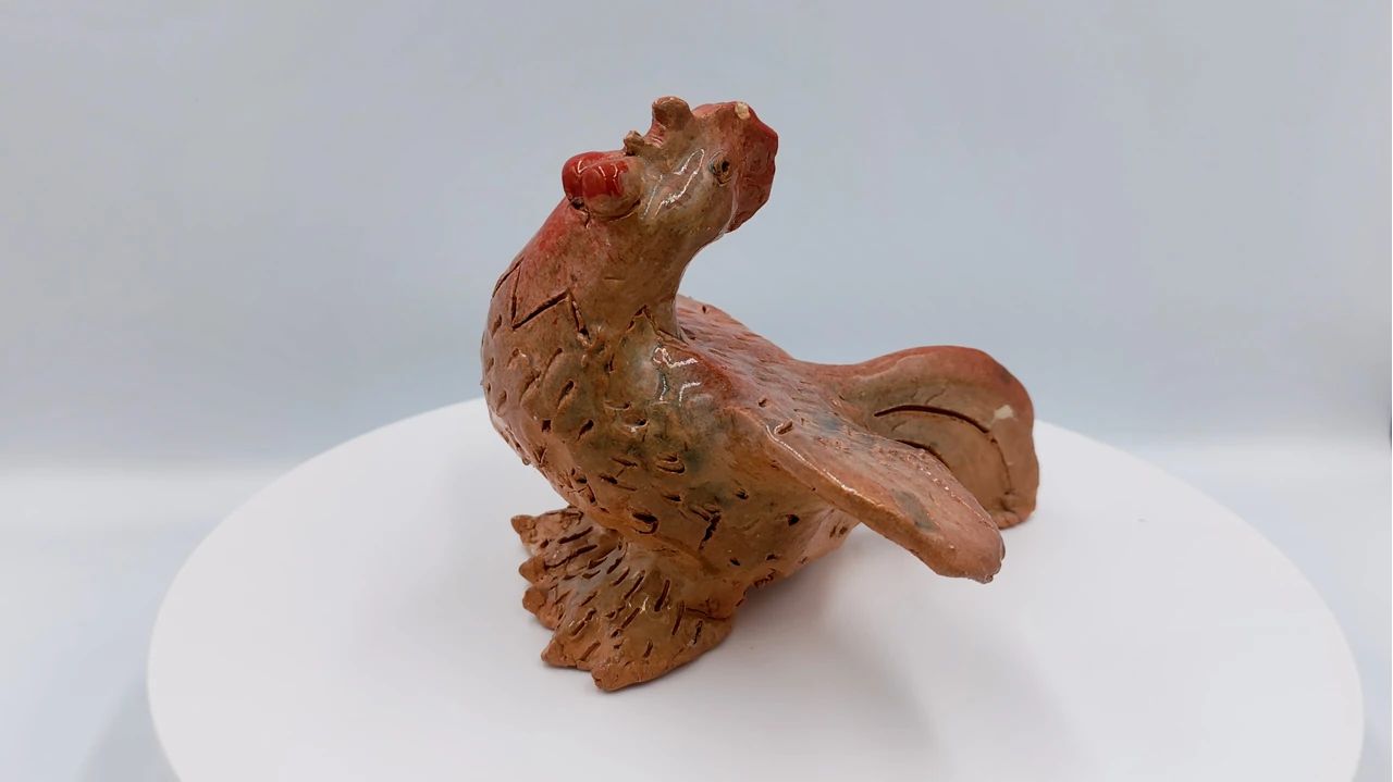 Frame from the video overview of Slava Romanenko’s ceramic work “Singing Rooster”.