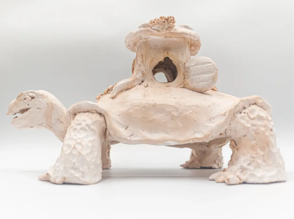 Turtle, a clay work by Slava Romanenko with a small house on its shell.