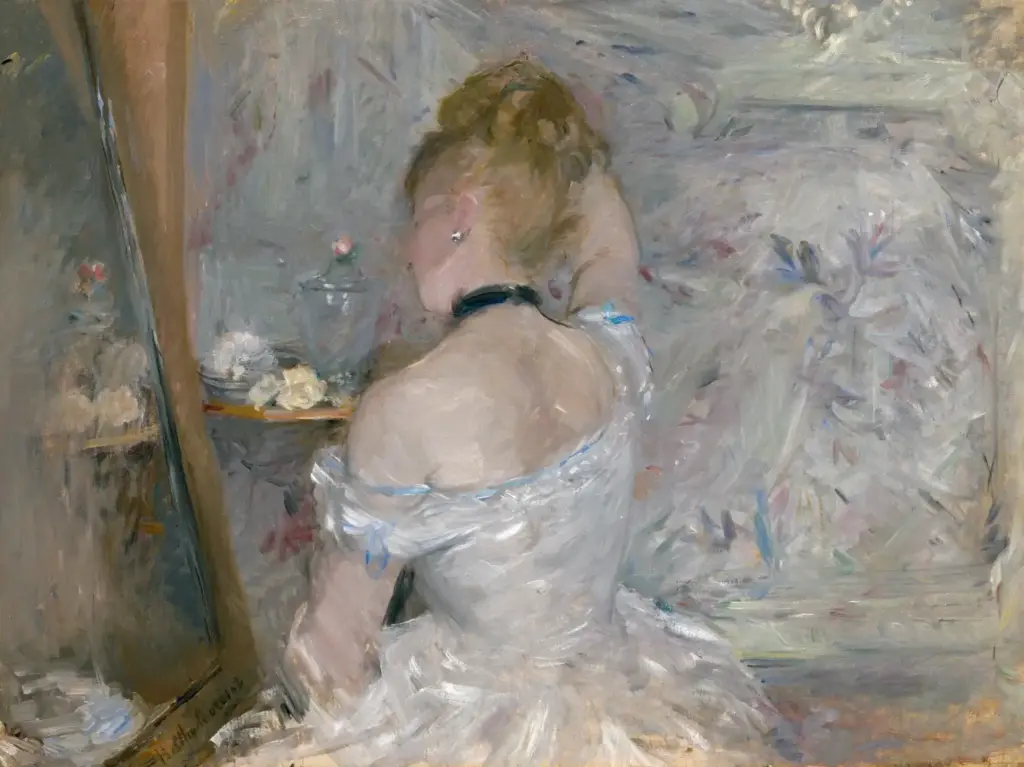 Berthe Morisot’s Woman at Her Toilette, showing a seated woman from behind before a mirror in a pale interior.