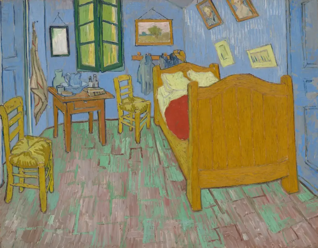 Vincent van Gogh’s The Bedroom, showing a blue-walled room with a wooden bed, chairs, and framed pictures.